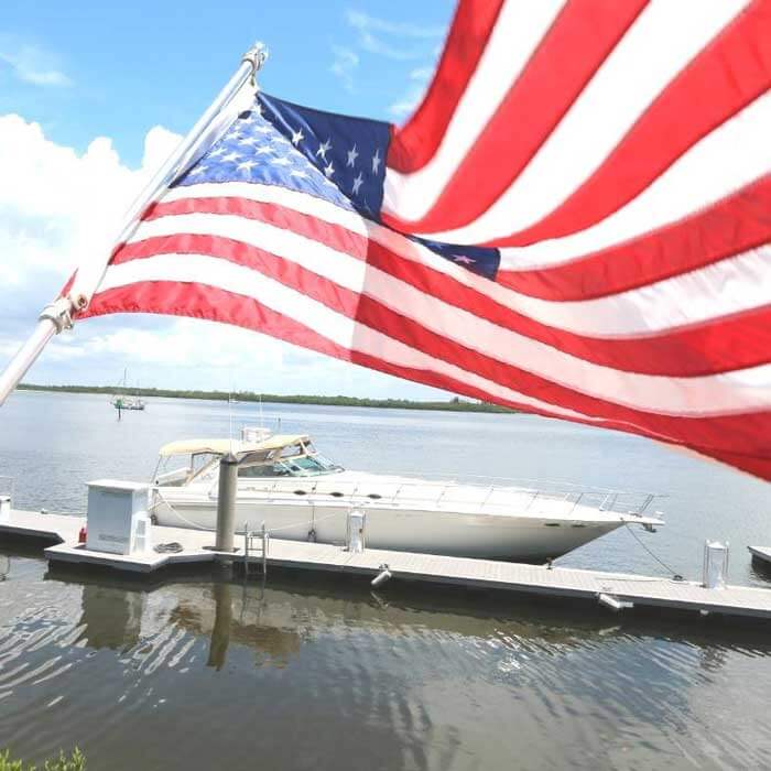 American flag waves by the Fort Myers marina at Pink Shell Resort