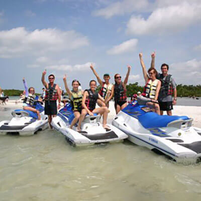 Guests ride jet skis on a Dolphin tour in Fort Myers Beach