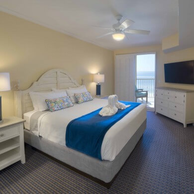 White sand villa bedroom overlooking the beach