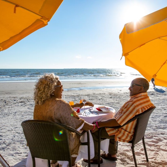 Couple dines on the beach