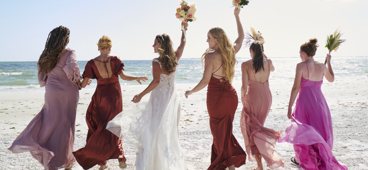 Bridal Party Celebrating On The Beach