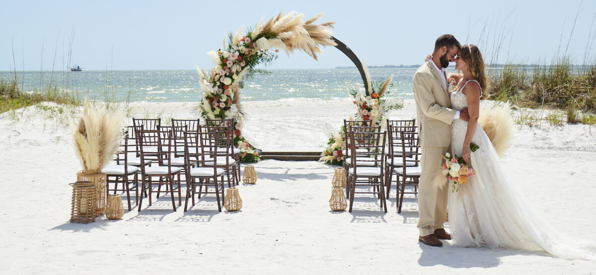 Wedding arch setup on the private beach at Pink Shell Resort