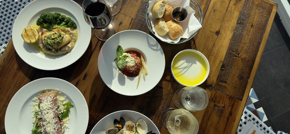 Plates & drinks on a table at Rae's Real Italian