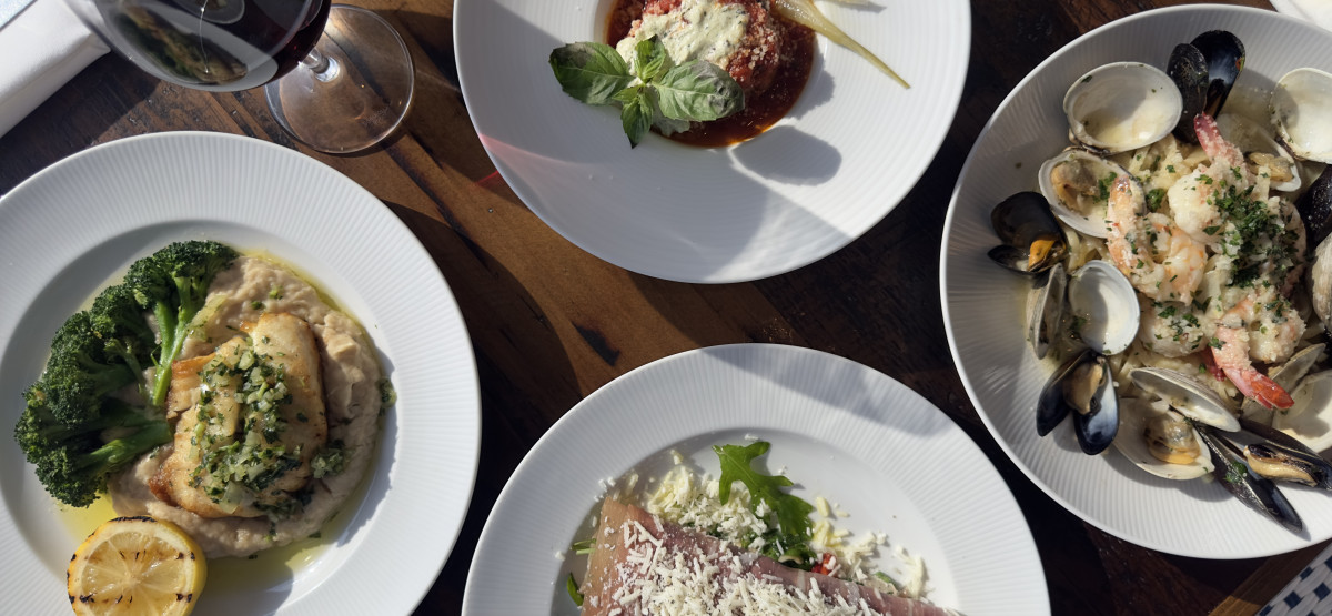 Selection of drinks and dishes on table at Raes