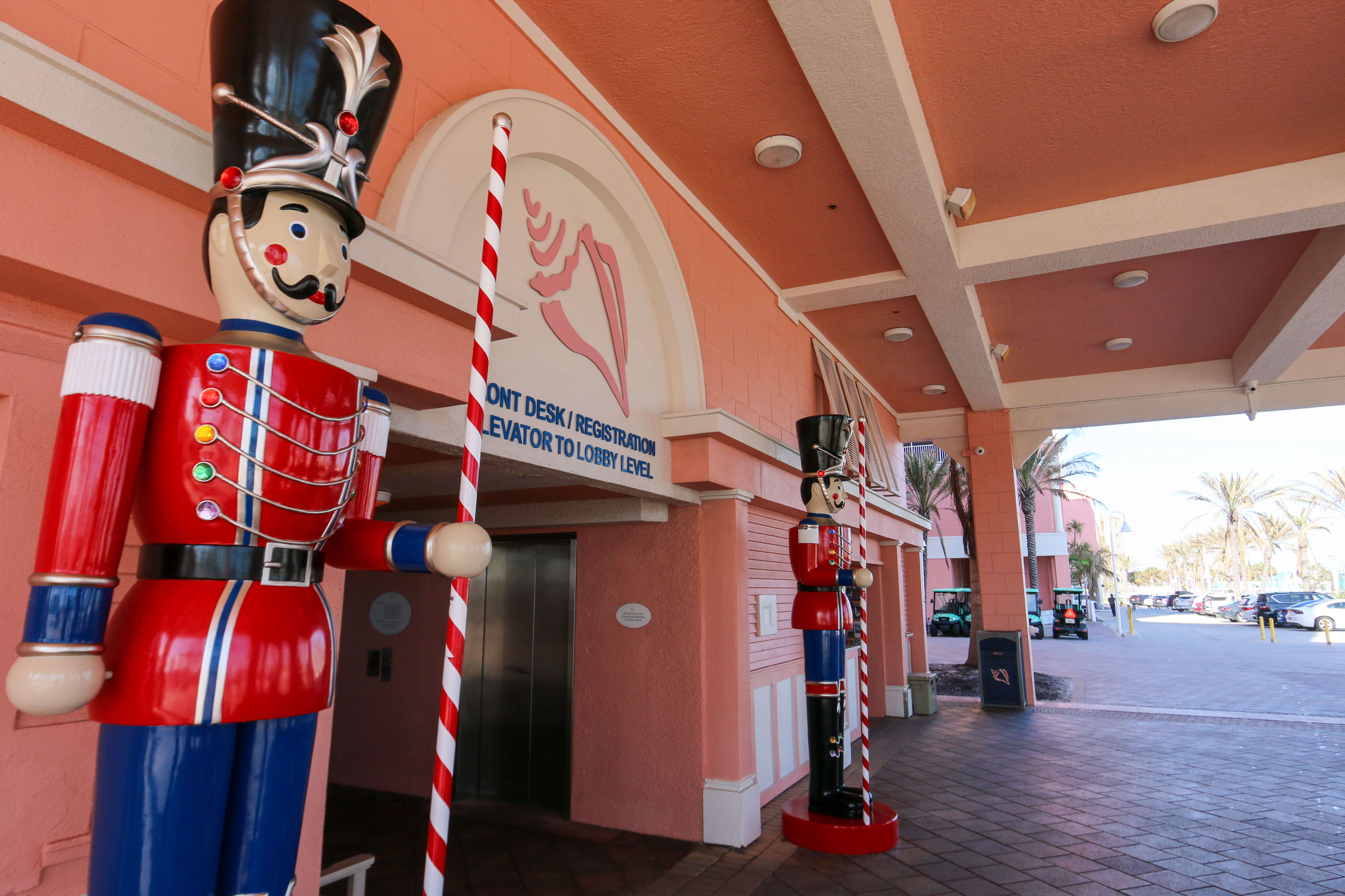 Nutcracker statues stand next to the Pink Shell Resort entrance during the holidays