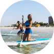 guests enjoy complimentary SUP rentals in Fort Myers Beach