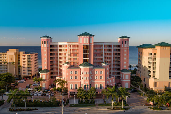 Front of pink shell resort building