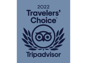 Blue graphic displaying "2022 Travelers' Choice Tripadvisor" with an owl logo and laurel leaves.